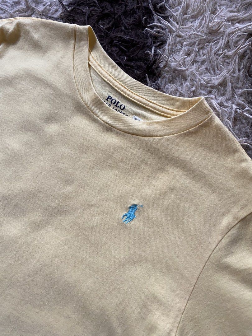 Polo Ralph Lauren Yellow size M (Category: Tshirts & Polo Shirts ) located in Manila. Submitted by coollion.19b40f (Listing ID 1468256104, Image 2). Description: - Brand: Polo Ralph Lauren - Color: Vibrant Yellow with Light Blue Embroidered Pony Logo - Size: Kids Medium (10-12 years / 150/72) - Material: 100% Cotton - Design: Classic crew neck, short sleeves - Condition: Wash tag and printed neck label intact - Origin: Made in Cambodia.