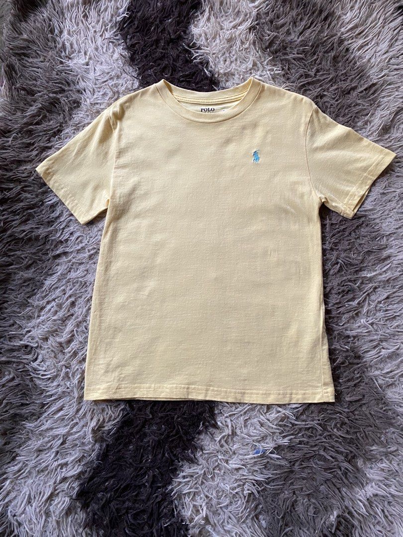 Polo Ralph Lauren Yellow size M (Category: Tshirts & Polo Shirts ) located in Manila. Submitted by coollion.19b40f (Listing ID 1468256104, Image 1). Description: - Brand: Polo Ralph Lauren - Color: Vibrant Yellow with Light Blue Embroidered Pony Logo - Size: Kids Medium (10-12 years / 150/72) - Material: 100% Cotton - Design: Classic crew neck, short sleeves - Condition: Wash tag and printed neck label intact - Origin: Made in Cambodia.