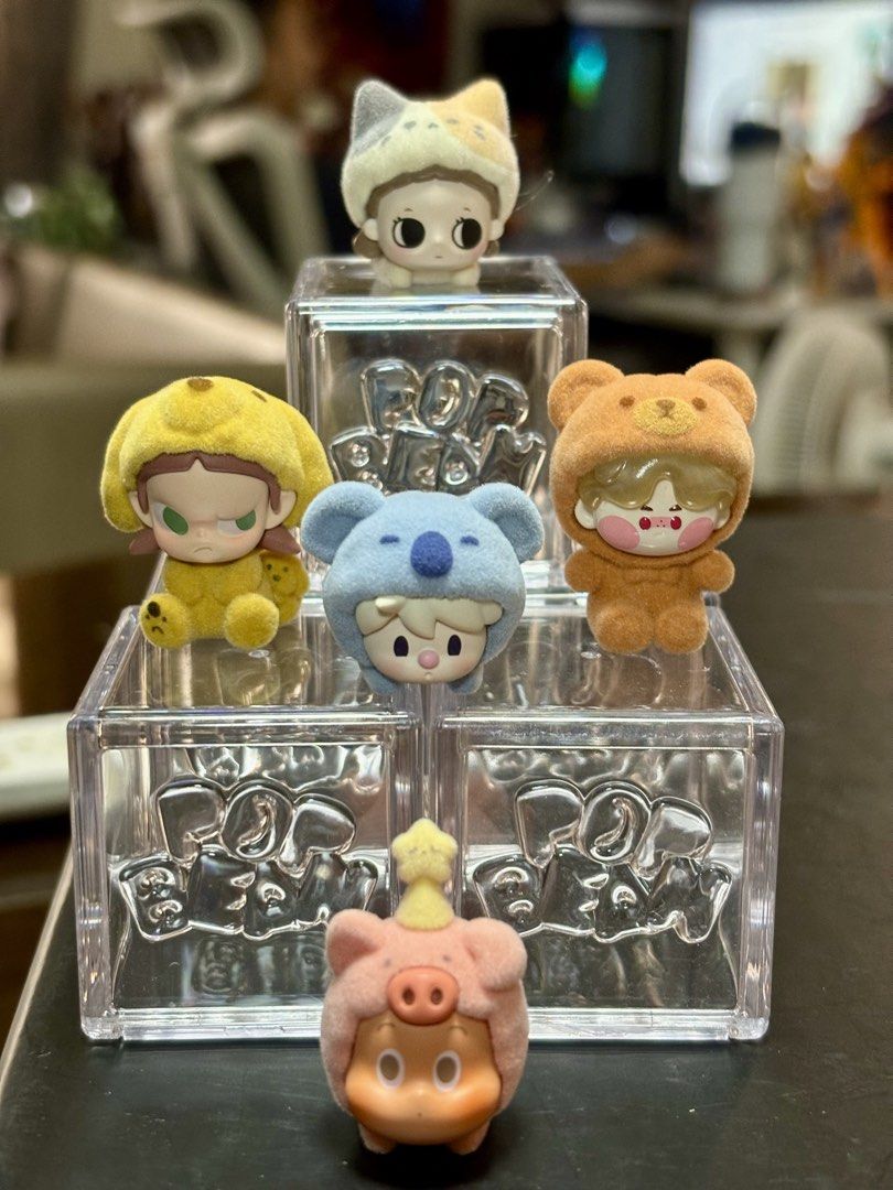 Pop Bean pajama cross dressing with Display Cases (Category: Designer & Blind Box Toys) located in Pasig City. Submitted by k8s_charm_est.2021 (Listing ID 1468086337, Image 1). Description: - Complete set of 5 Skullpanda Pop Mart blind box figures: cat, bear, koala, pig, and yellow hooded character - Includes a clear stackable display cube for every single figurine - Features soft flocked texture on the animal onesies - RFS: Decluttering / Extra 