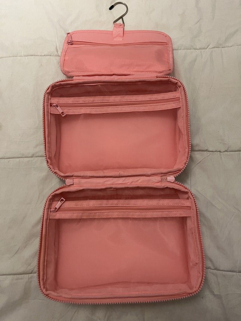 Popique Pink Gingham Hanging Toiletry Bag (Category: Beach Bags) located in Manila. Submitted by beautyarchives (Listing ID 1468201030, Image 3). Description: popique beauty gingham toiletry bag a cute and functional organizer for your beauty essentials • pink and white gingham print • yellow popique lettering on the front • bright blue top handle • built in metal hanging hook • multiple zip compartments and mesh pockets • spacious enough for you