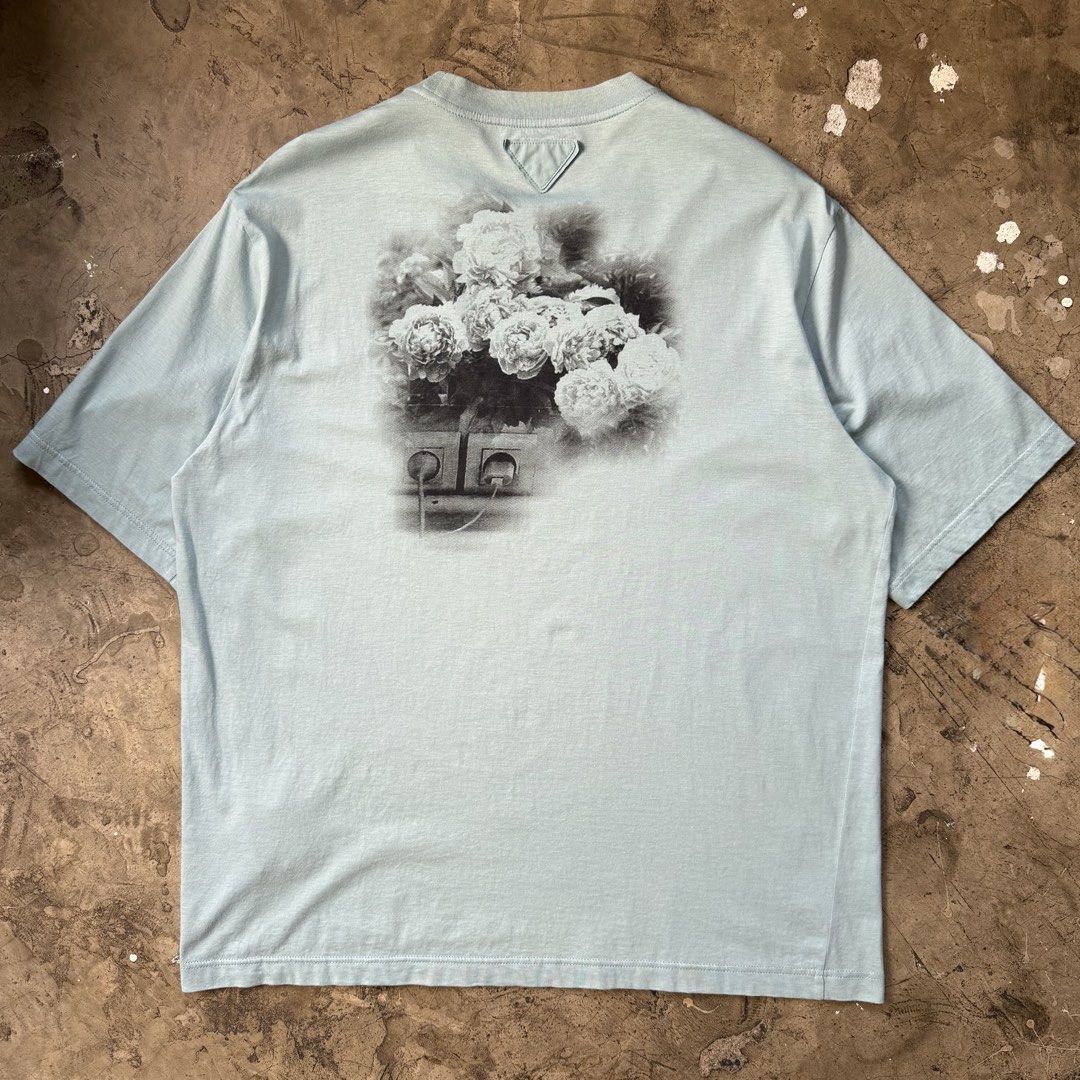 Prada - S/S22 Transfer Print Tee (Category: Tshirts & Polo Shirts ) located in Cavite. Submitted by 4118.ph (Listing ID 1468224941, Image 2). Description: Medium 9/10 condition Yellowing on neckline Width 22.5” Length 27.5”.