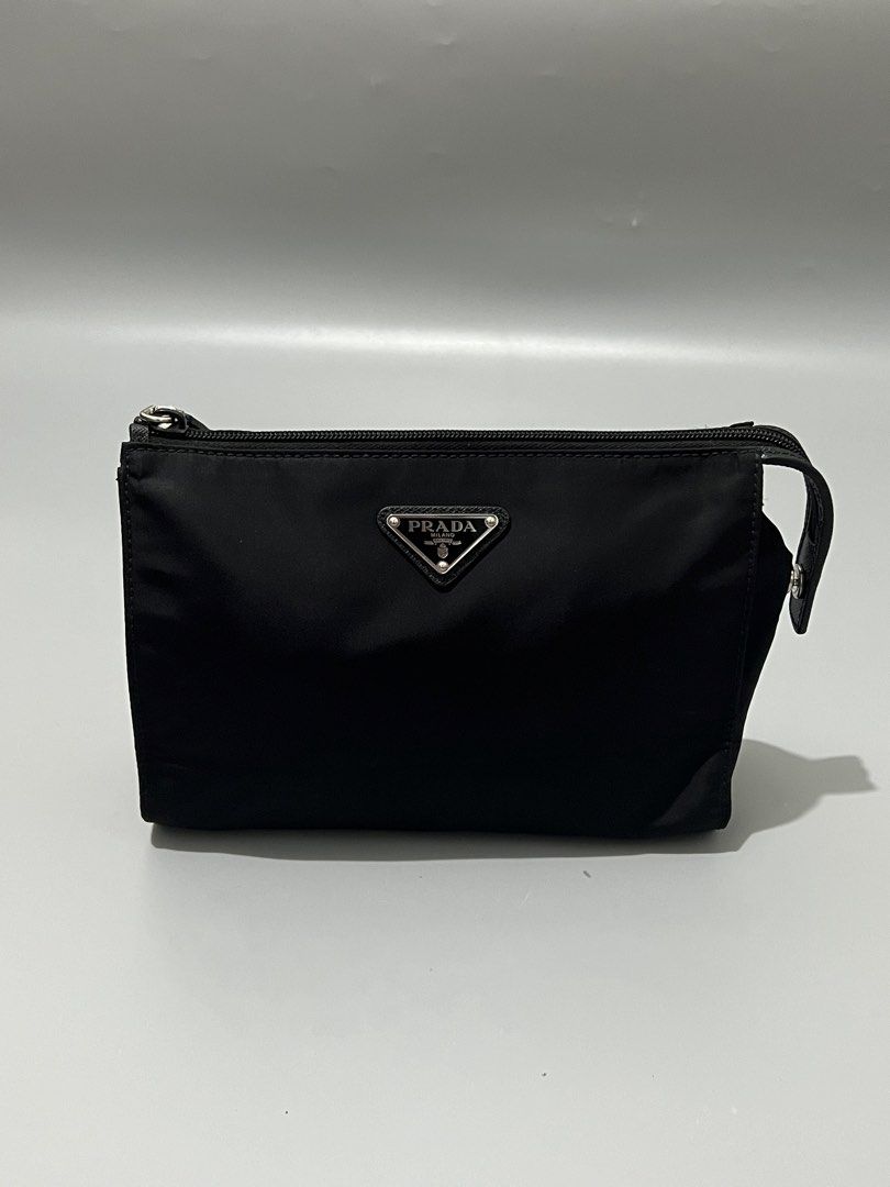 PRADA - Tessuto Nylon - Wristlet - (Category: Luxury Bags & Wallets) located in Cavite. Submitted by asianluxe (Listing ID 1468174894, Image 1). Description: Prada - Nylon - Wristlet Measurements Length: 17 Cm Width: 22 Cm Depth: 8 Cm Like new condition Excellent condtion Very presentable No flaw or damage.
