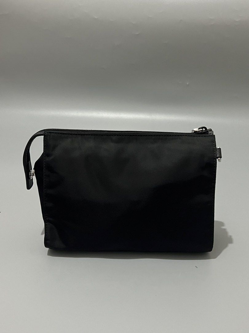 PRADA - Tessuto Nylon - Wristlet - (Category: Luxury Bags & Wallets) located in Cavite. Submitted by asianluxe (Listing ID 1468174894, Image 3). Description: Prada - Nylon - Wristlet Measurements Length: 17 Cm Width: 22 Cm Depth: 8 Cm Like new condition Excellent condtion Very presentable No flaw or damage.