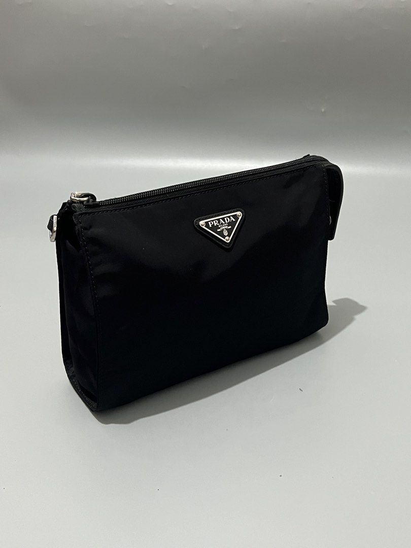 PRADA - Tessuto Nylon - Wristlet - (Category: Luxury Bags & Wallets) located in Cavite. Submitted by asianluxe (Listing ID 1468174894, Image 2). Description: Prada - Nylon - Wristlet Measurements Length: 17 Cm Width: 22 Cm Depth: 8 Cm Like new condition Excellent condtion Very presentable No flaw or damage.