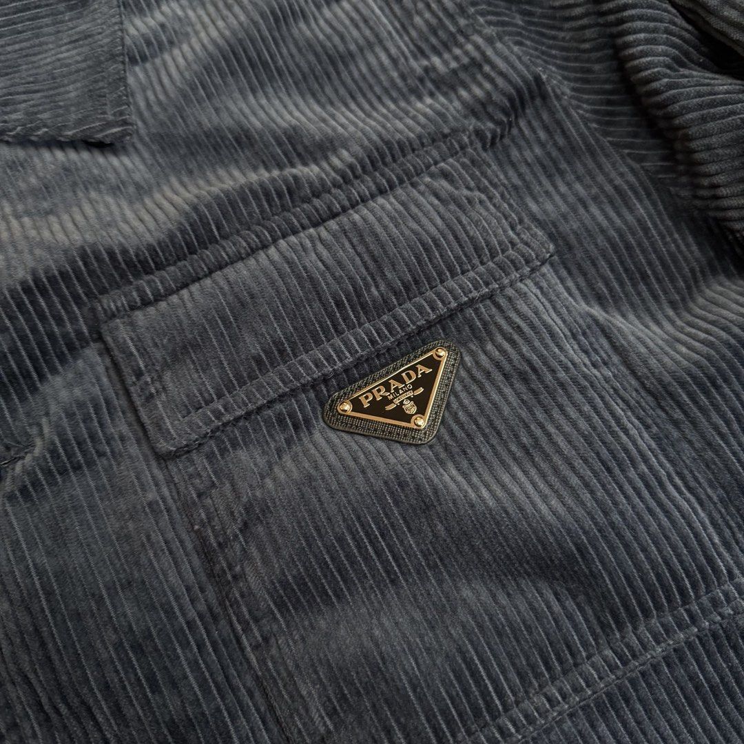 Prada Black Corduroy Quilted Jacket Size S (Category: Coats, Jackets and Outerwear) located in Legazpi City. Submitted by keantuttt (Listing ID 1468136466, Image 3). Description: - Authentic Prada corduroy jacket - Size: S - Color: Classic Black - Warm quilted inner lining for extra comfort - Front button closure with chest and lower flap pockets - Iconic Prada metal triangle logo badge on left chest pocket - Heavy, premium ridged corduroy textur