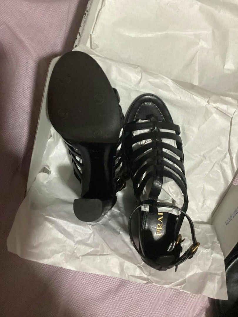 Prada Black Leather Gladiator Sandals Heels Size 37 (Category: Flats & Sandals) located in Paranaque City. Submitted by calm_youngstore7 (Listing ID 1468236766, Image 3). Description: PRADA GLADIATOR CAGE HEELS - Brand: Prada - Style: Black leather gladiator heels / strappy cage design with ankle buckle closures - Heel: Chunky block heel for stability and comfort - Size: 37 (stamped on leather sole) - Inclusions: Original box and tissue paper pac