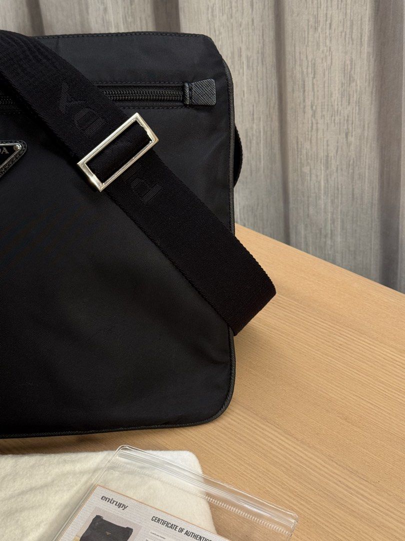 Prada Black Nylon Medium Crossbody Bag - Authentic (Category: Luxury Bags & Wallets) located in Mandaluyong City. Submitted by yumbougieee (Listing ID 1468121641, Image 2). Description: Original Prada Mens Crossbody Bag Like new condition. Gently used 9/10 12.5 width x 10.5 height inches dimes Black na black. No stains, no discolor 20k With Entrupy certificate + dust bag.