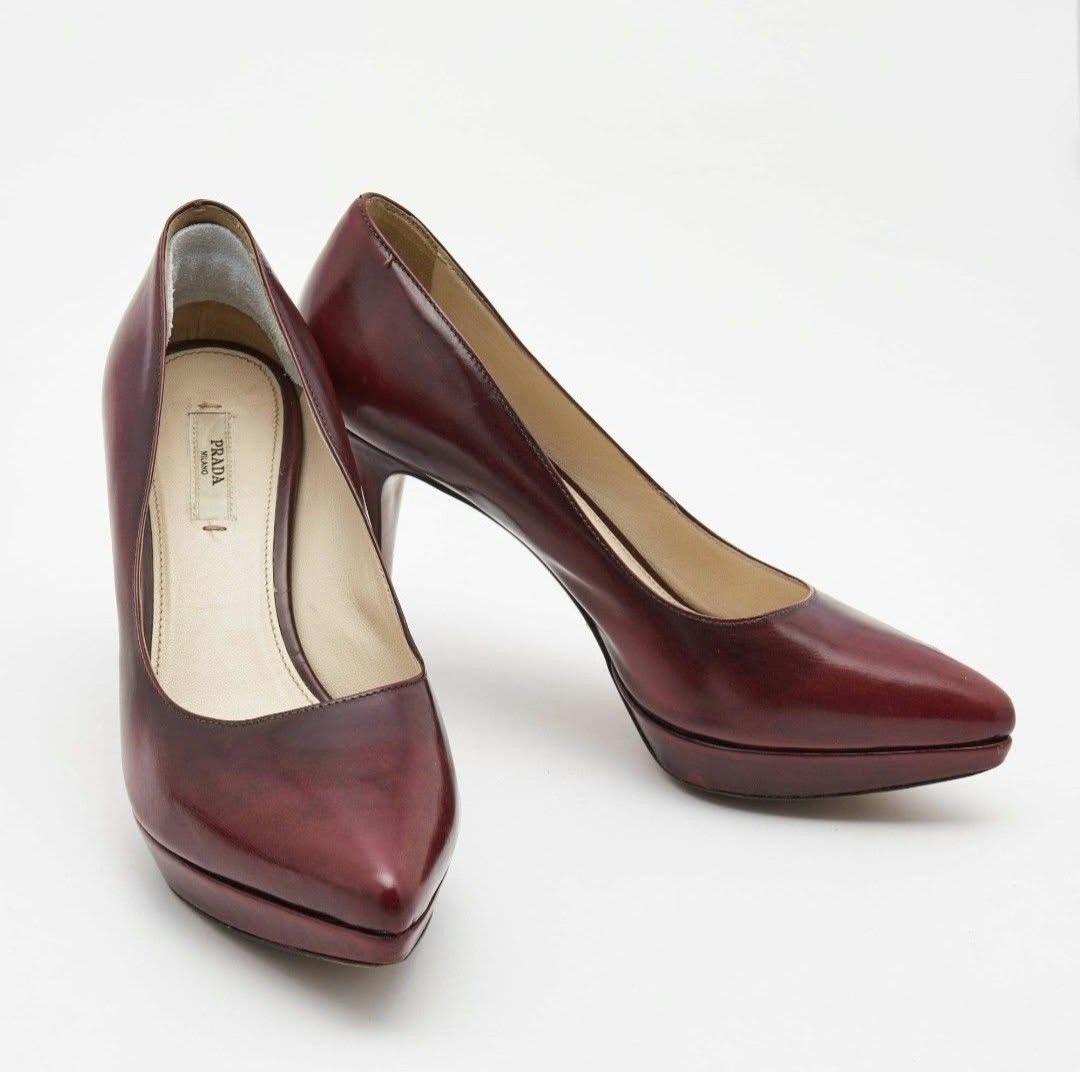 Prada Burgundy Leather Platform Pumps Size 36 (Category: Heels) located in Paranaque City. Submitted by calm_youngstore7 (Listing ID 1468236274, Image 2). Description: - Brand: Prada - Style: Pointed toe stiletto with hidden platform - Material: Rich deep burgundy leather with natural color variation - Size: 36 (stamped on leather sole) - Origin: Made in Italy - Details: Interior gold Prada logo plaque and clean lining - Condition: Excellent, bea