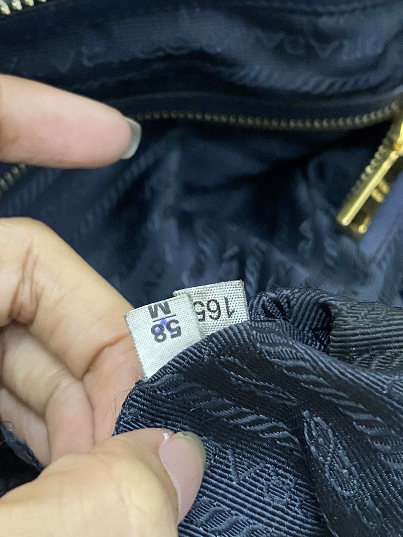 Prada Nylon Tote Bag Navy Blue (Category: Luxury Bags & Wallets) located in Manila. Submitted by grandowl_5653cd (Listing ID 1468246227, Image 2). Description: - Prada Nylon Tote in a rare dark navy blue shade - Luxurious gold-tone hardware and smooth Riri zippers.