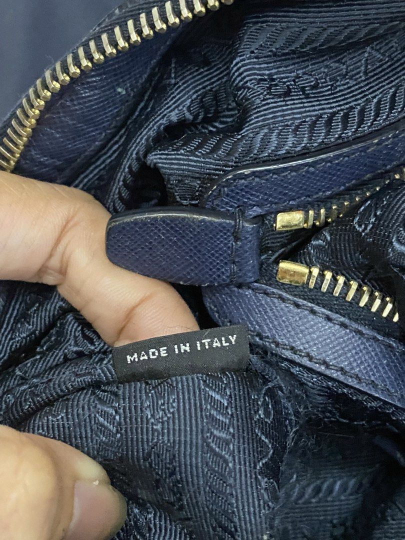 Prada Nylon Tote Bag Navy Blue (Category: Luxury Bags & Wallets) located in Manila. Submitted by grandowl_5653cd (Listing ID 1468246227, Image 3). Description: - Prada Nylon Tote in a rare dark navy blue shade - Luxurious gold-tone hardware and smooth Riri zippers.