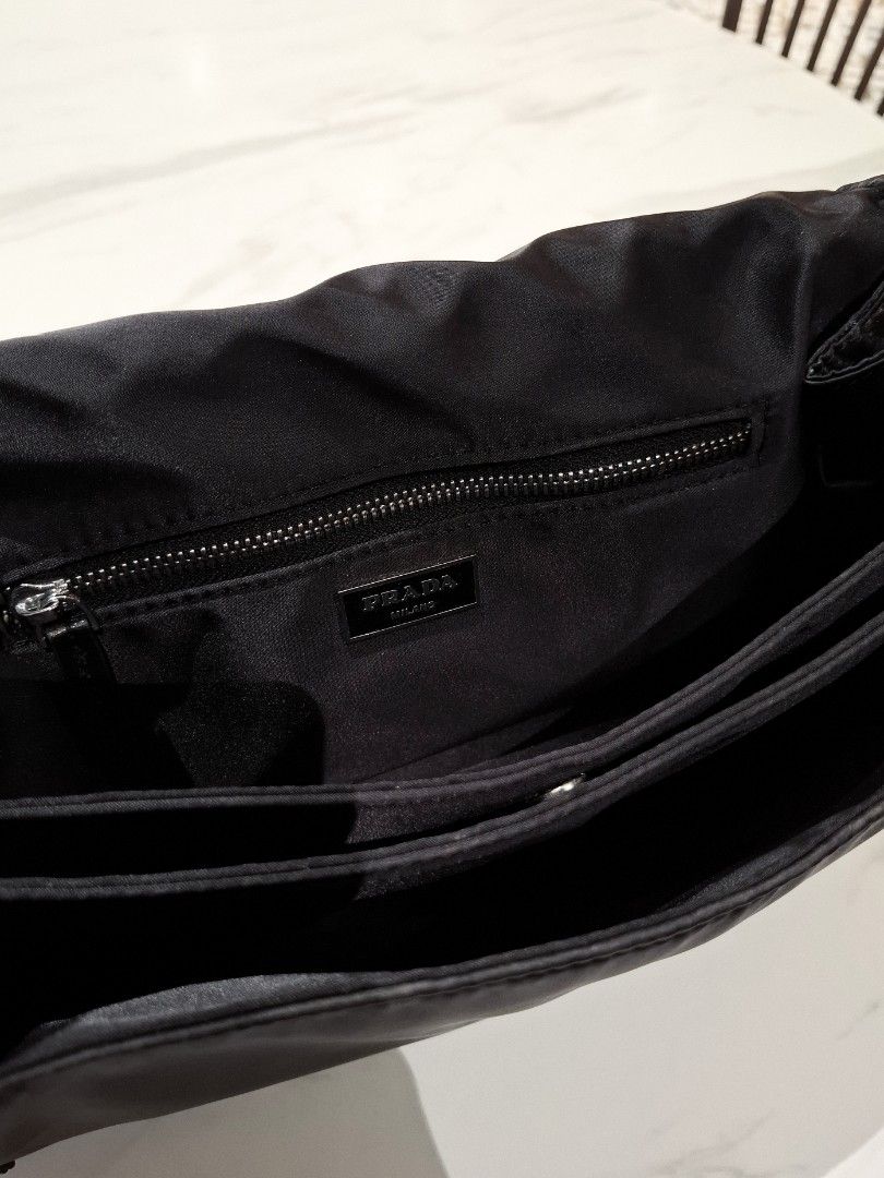 Prada Traveller Medium Padded Re - nylon Bag (Category: Luxury Bags & Wallets) located in Pasig City. Submitted by coveted.mnl (Listing ID 1468158739, Image 3). Description: Authentic📌 Lost Strap Only. Width : Height : Base : (MEASURED BY INCHES) 9.5/10 overall condition No issues or flaws in fabric Need rewash only Retailed for $2800 (P173,600) • P Slightly negotiable • Pasig City meet up • Open for COD Via Lalamove or Grab • J&T courier Messag