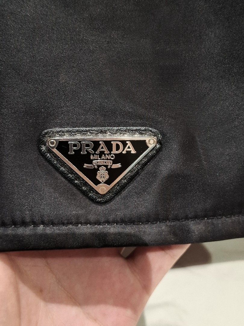 Prada Traveller Medium Padded Re - nylon Bag (Category: Luxury Bags & Wallets) located in Pasig City. Submitted by coveted.mnl (Listing ID 1468158739, Image 2). Description: Authentic📌 Lost Strap Only. Width : Height : Base : (MEASURED BY INCHES) 9.5/10 overall condition No issues or flaws in fabric Need rewash only Retailed for $2800 (P173,600) • P Slightly negotiable • Pasig City meet up • Open for COD Via Lalamove or Grab • J&T courier Messag