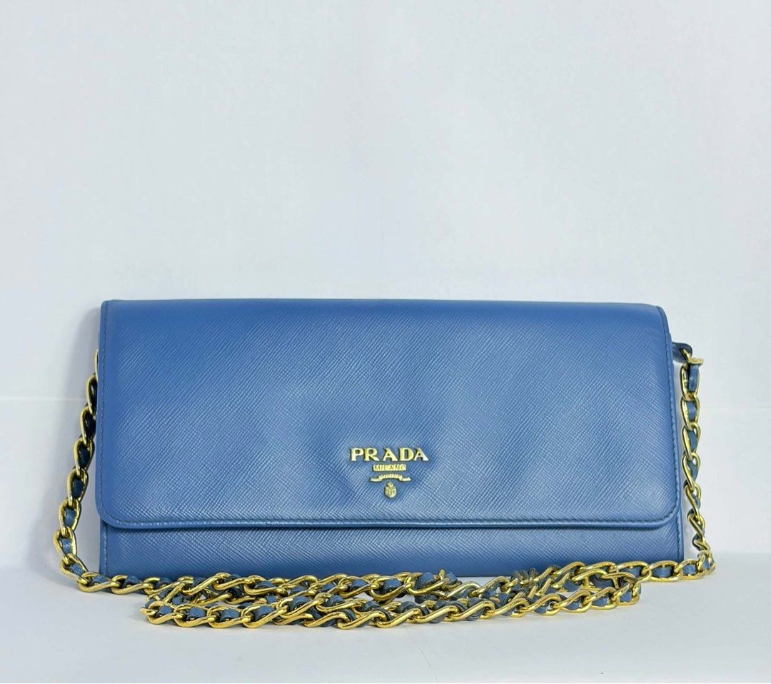Prada wallet on chain (Category: Luxury Bags & Wallets) located in Pasig City. Submitted by fajardorelovedluxury (Listing ID 1468139582, Image 1). Description: Original, preloved with sign of use.