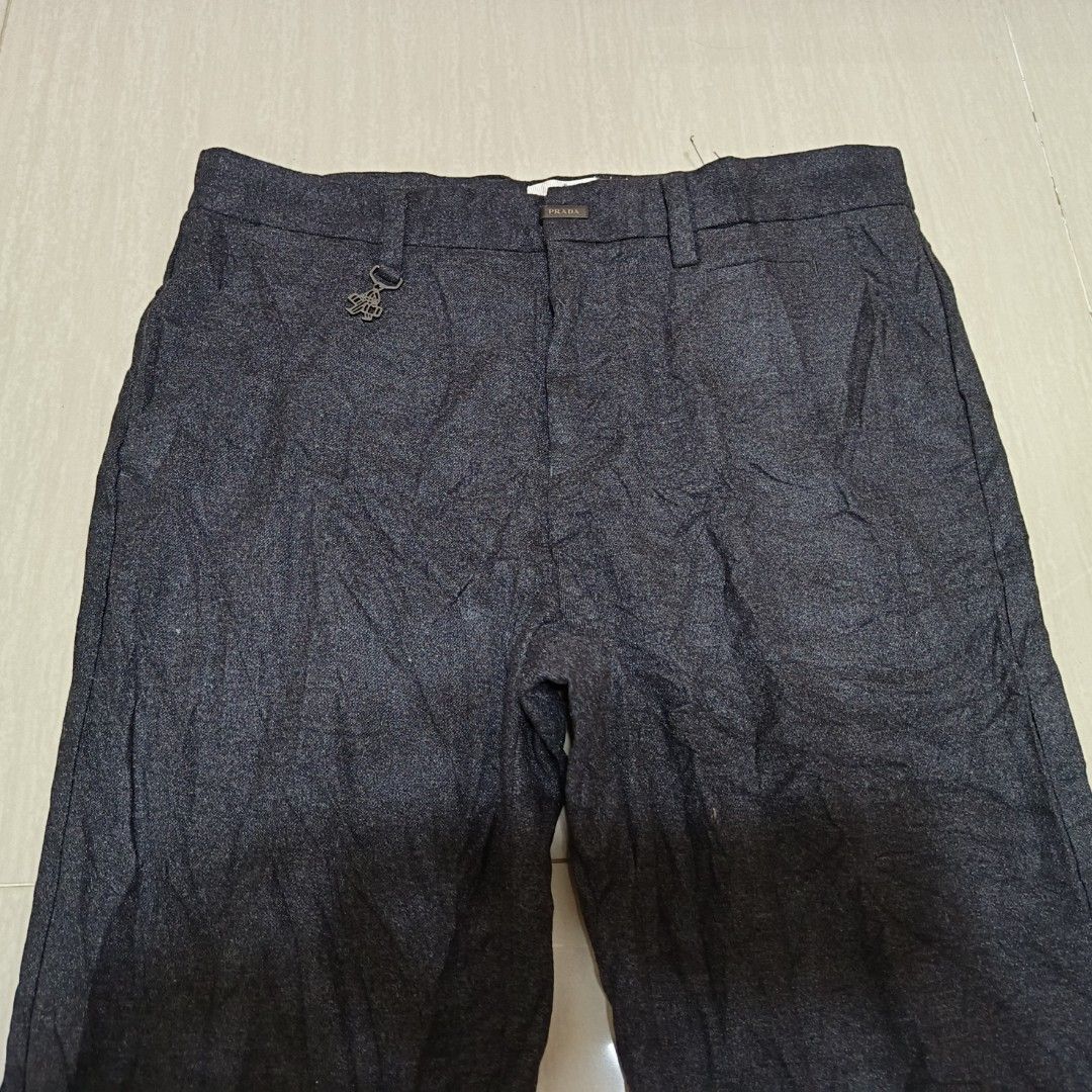 PRADA Wool Pants Dark Grey Size 30 (Category: Trousers) located in Nasugbu. Submitted by staffpicks1515 (Listing ID 1468222153, Image 3). Description: Prada wool pants in dark grey. Riri zip closure. Two side pockets plus two back pockets. Tagged size 30. Measurements: waist 30 inches, outseam 36.5 inches, inseam 27 inches, hips 19.5 inches, rise 11.5 inches, thigh 10 inches, leg opening 6.5 inches. Made in Bulgaria. Clean piece..