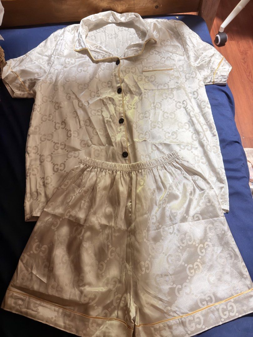 Pre-loved Monogram Silk Short Sleeve Pajama Set (Category: Undergarments & Loungewear) located in Manila. Submitted by badassjowie (Listing ID 1468069718, Image 1). Description: - Nude silk pajama set with interlocking monogram pattern - Short-sleeve button-down top featuring a chest pocket - Matching shorts with a comfortable elastic waistband - Chic yellow piping trim along the collar, pocket, cuffs, and hem - Soft, lightweight fabric perfect f