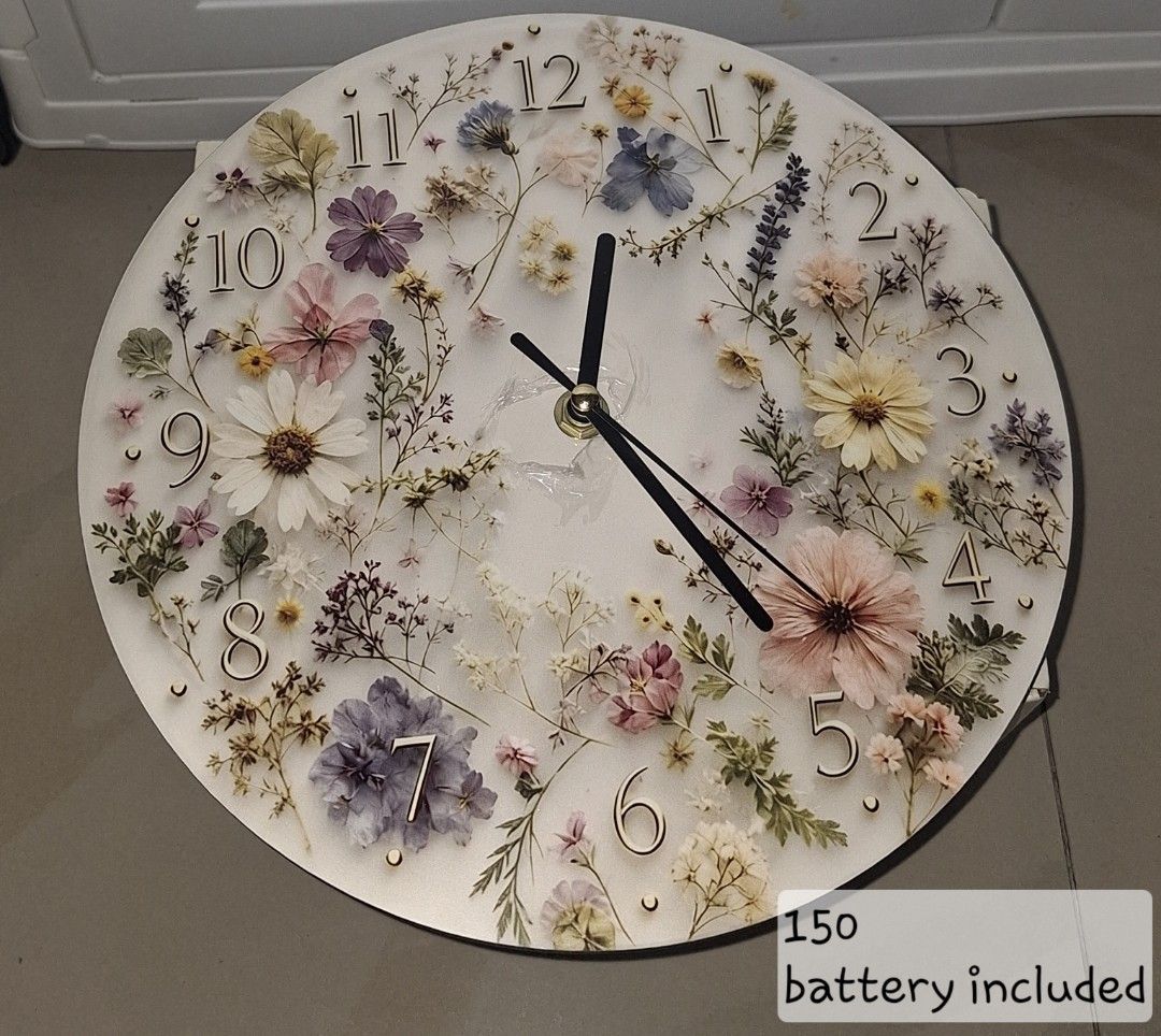 Pressed Flower Resin Wall Clock with Battery (Category: Clocks) located in Manila. Submitted by noblegem04 (Listing ID 1468135765, Image 1). Description: - Elegant round wall clock with real pressed dried flowers in clear resin - Clean white background with easy-to-read black hands and numbers (1-12) - Standard size wall decor, ready to hang upon arrival - FREE battery already included in the package - Price: ₱150 only!.