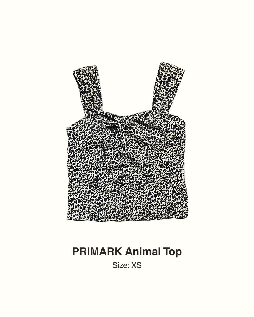 PRIMARK Animal Top Size XS (Category: Sleeveless) located in Manila. Submitted by maaya.rikit (Listing ID 1468104345, Image 1). Description: - Brand: Primark - Size: XS - Pattern: Black and white leopard print - Design: Square neckline, thick straps, and front knot detail - Fit: Cropped length, soft, and stretchy fabric.