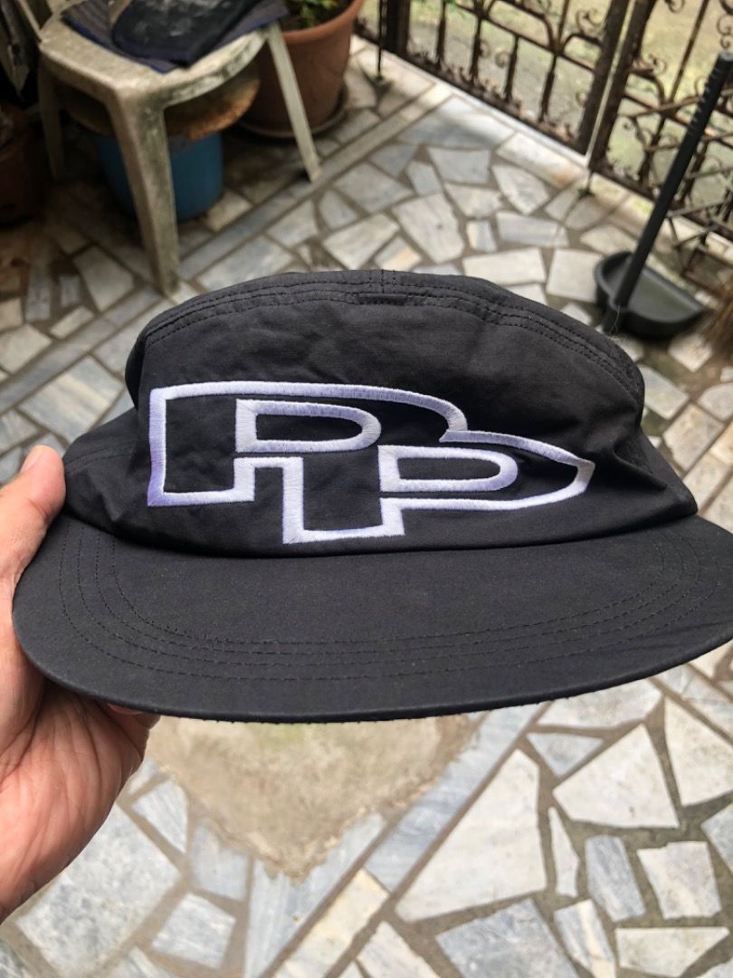 PUBLIC PHARMACY Big Logo Cap Black (Category: Caps & Hats) located in Mandaluyong City. Submitted by philbert420 (Listing ID 1468105489, Image 1). Description: - Brand: Public Pharmacy - Item: Black nylon snapback hat - Condition: Brand new with tags (BNWT) - Design: Big white PP embroidered logo on front panels - Fit: Classic unstructured fit with curved brim and tonal stitching - Style: Streetwear, perfect for casual everyday outfits.
