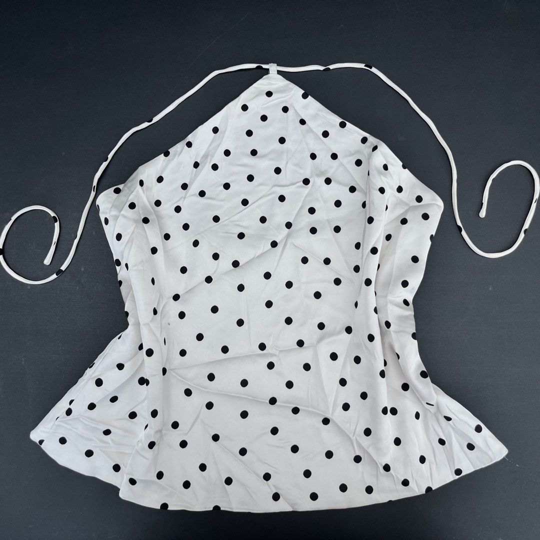 Pull&Bear White & Black Polka Dot Halter with side zipper (Category: Sleeveless) located in Surigao. Submitted by rynryngoaway (Listing ID 1468118122, Image 1). Description: Cute and classy Pull&Bear polka dot halter top 🤍🖤 Features a white fabric with black polka dots, a flattering halter neckline, and a flowy, flared hem. Perfect for casual outfits, summer days, vacations, or a chic Y2K-inspired look! Can fit medium because of china sizing ar
