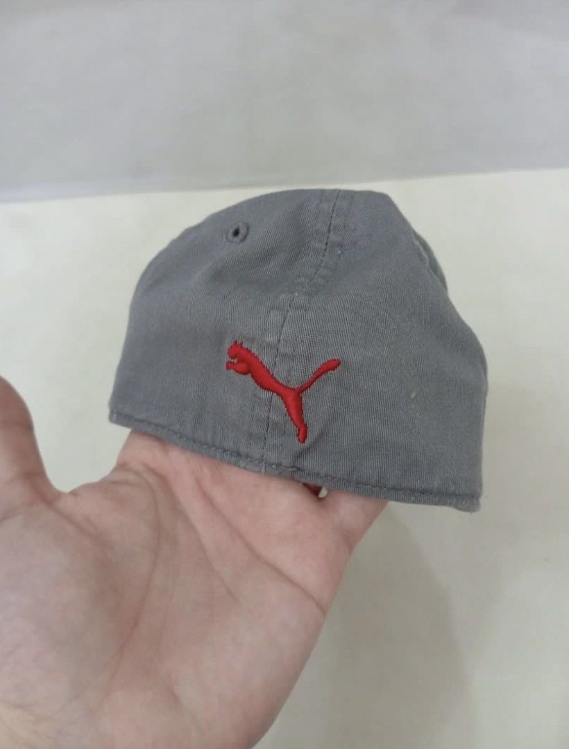 Puma Gray Cap with Red Logo (Category: Babies & Kids Fashion) located in Legazpi City. Submitted by iceyag (Listing ID 1468072673, Image 2). Description: - Brand: Puma - Color: Gray with red embroidered leaping cat logo - Size: Infant sizing (refer to inner tags) - Design: Curved brim with stitching and branded interior taping - Style: Classic and casual, perfect for everyday wear.