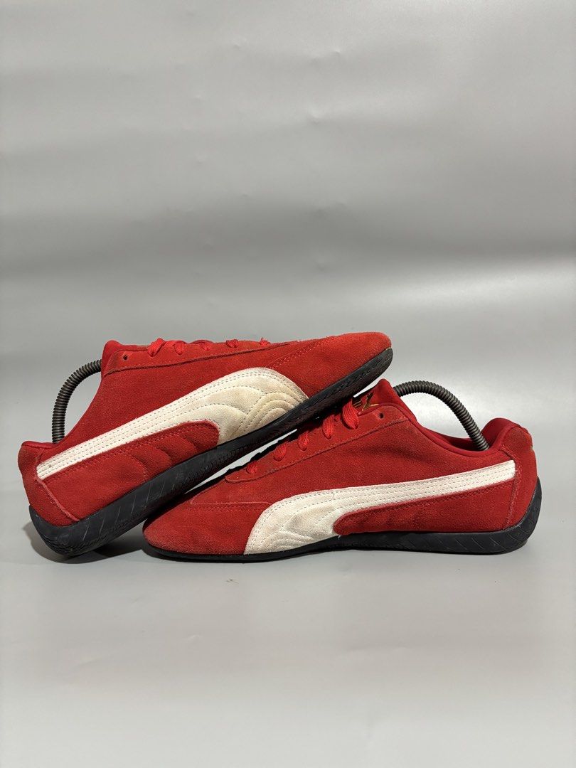 Puma Red White Speedcat Sneakers Size 9 US (Category: Sneakers) located in Butuan. Submitted by shoeetasho (Listing ID 1468212606, Image 3). Description: - Brand/Model: Puma Motorsport Red Suede Sneakers - Size: 9 US / 42 EUR / 27cm - Design: Red suede upper, white side stripes, and gold branding - Outsole: Grippy rubber with unique tire tread pattern and red Puma logos - Inclusions: Standard red laces - Condition: Suede upper shows minor natural
