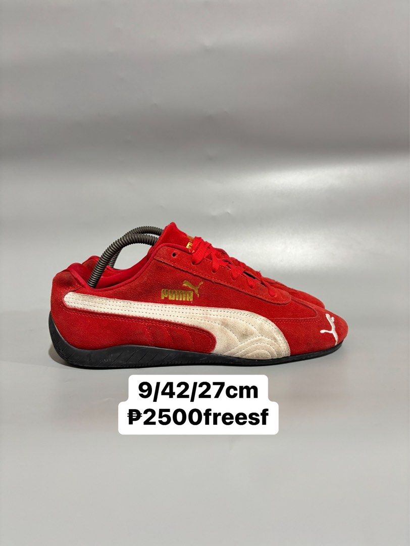 Puma Red White Speedcat Sneakers Size 9 US (Category: Sneakers) located in Butuan. Submitted by shoeetasho (Listing ID 1468212606, Image 1). Description: - Brand/Model: Puma Motorsport Red Suede Sneakers - Size: 9 US / 42 EUR / 27cm - Design: Red suede upper, white side stripes, and gold branding - Outsole: Grippy rubber with unique tire tread pattern and red Puma logos - Inclusions: Standard red laces - Condition: Suede upper shows minor natural