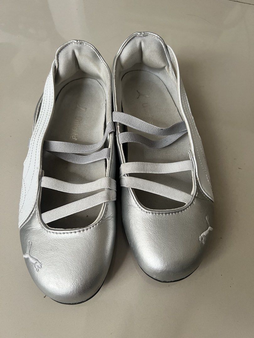 Puma Silver Ballet Sneakers Size US 7.5 (Category: Sneakers) located in Taguig. Submitted by fifileen (Listing ID 1468209056, Image 1). Description: Silver Puma slip-on ballet sneakers. White side stripe and crossover elastic straps. OrthoLite insoles for extra comfort. Size US 7.5, EUR 38, UK 5, 24 cm. Made in Vietnam. Light wear on soles, uppers still look clean and shiny. Easy to slide on for casual days out..