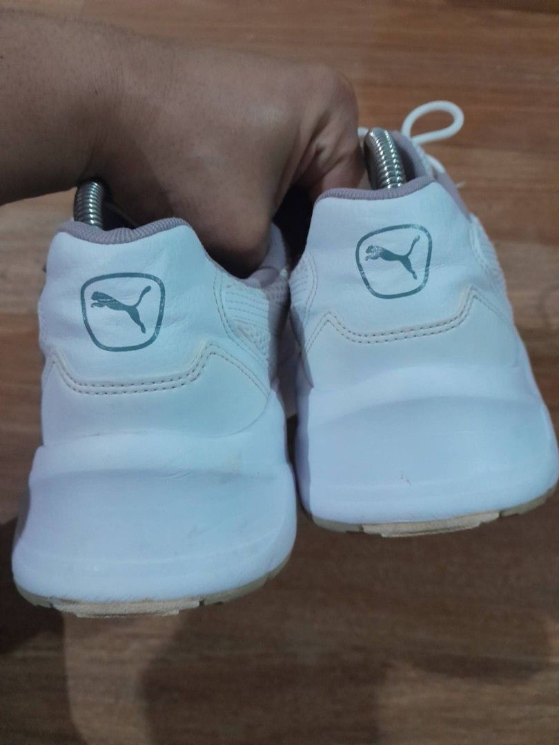 Puma White Chunky Sneakers (Category: Sneakers) located in Calamba. Submitted by ysabellascloset17 (Listing ID 1468080325, Image 3). Description: - Brand: Puma - Color: White with grey detailing - Material: Breathable mesh upper and chunky rubber sole with grip - Features: Classic Puma branding on tongue, heel, and side - Condition: Uppers are clean and intact; minor wear on outsoles and insoles from normal walking - Inclusions: Comes with origin
