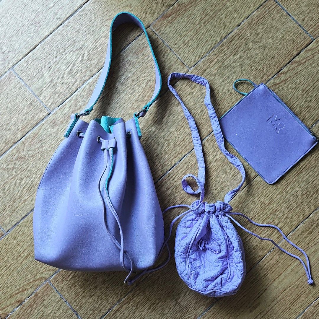 Purple Handbag Set with Pouch and Mini Bag (Category: Shoulder Bags) located in Manila. Submitted by archievienne.vtg (Listing ID 1468106208, Image 1). Description: ☆ Matching 3-piece lavender purple set for a coordinated look ☆Includes a large bucket shoulder bag with bright turquoise contrast lining ☆ Comes with a long-strap drawstring pouch bag ☆ With small flat zipper pouch.