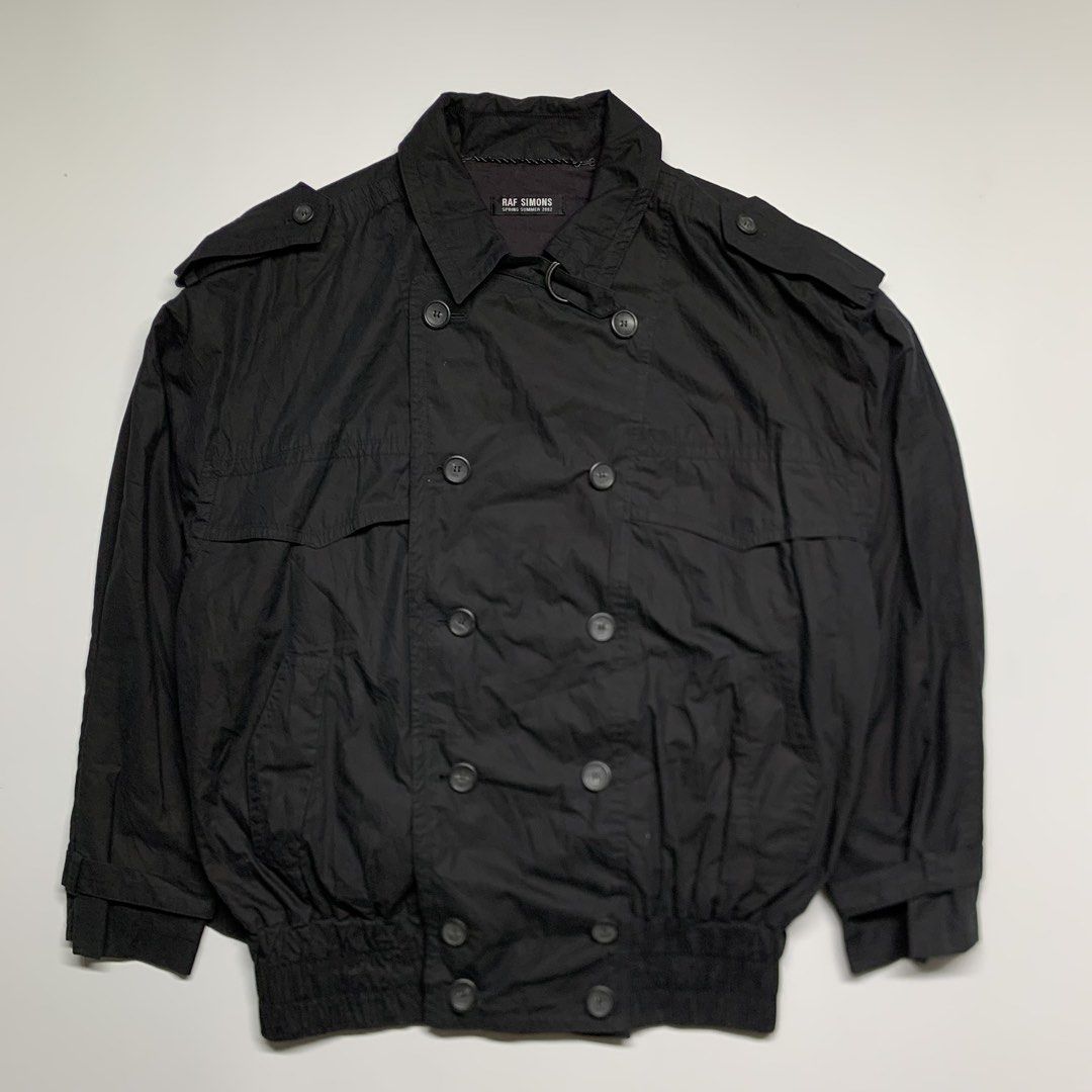 Raf Simons - SS/02 Trench-Bomber jacket (Category: Coats, Jackets and Outerwear) located in Manila. Submitted by shottas_21 (Listing ID 1468209958, Image 2). Description: Raf Simons - SS/02 Trench-Bomber SIZE - 46 CONDITION - 9/10 Made in belgium 100% Cotton CHEST - 28” LENGTH - 29.5” SHOULDERS - 26” SLEEVE - 23” HEM - 28”.