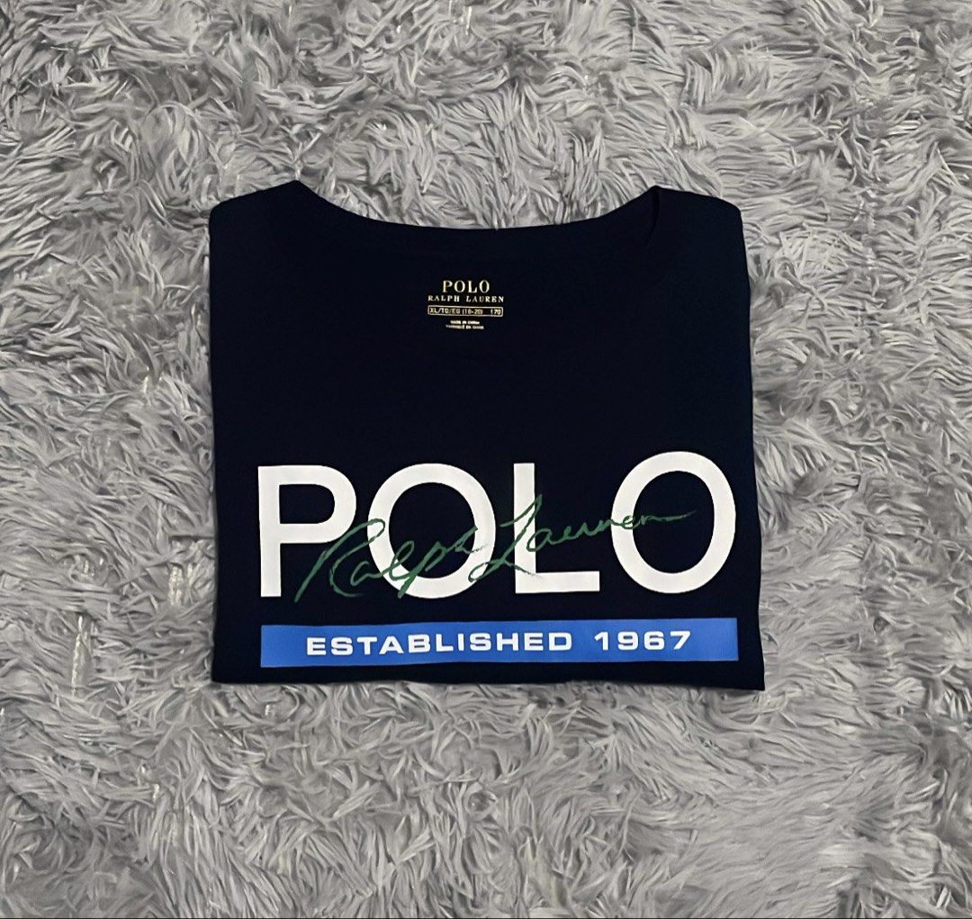 Ralph Lauren Printed Tee Navy Blue Shirt (Category: Tshirts & Polo Shirts ) located in Cebu City. Submitted by johnova18 (Listing ID 1468270094, Image 1). Description: Ralph Lauren Printed Tee Navy Blue Shirt Authentic ✅ Size: Medium(XL on tag) Width: 20.5 Length: 28 Color rate: 10/10 Pristine condition Good As New 2000 + shipping fee Location: Cebu City.