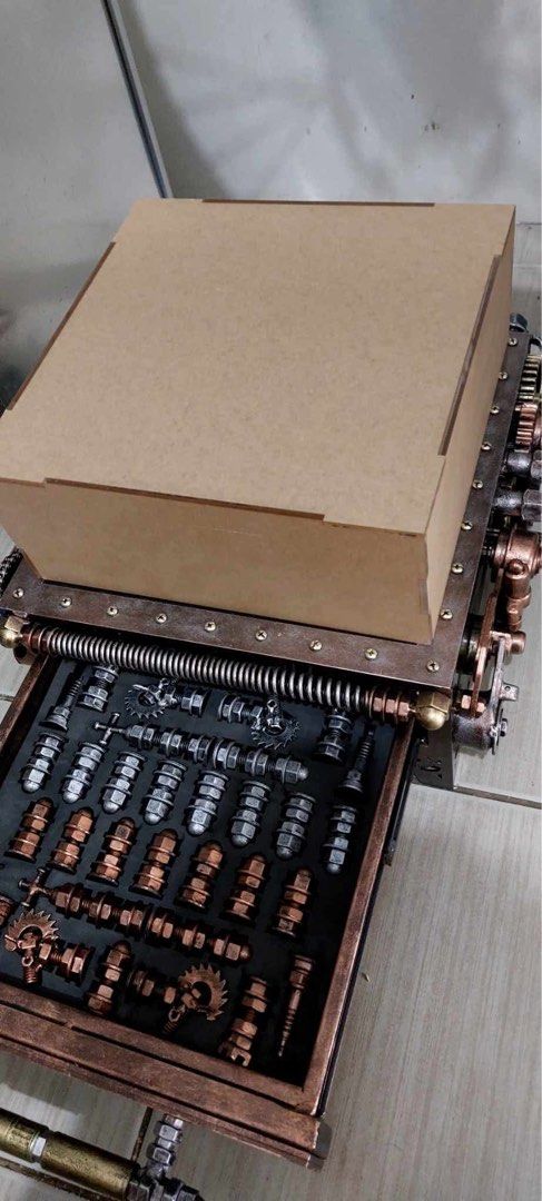 Ram Mallari Steampunk Custom Handmade Chess Set with Storage Drawer (Category: Vintage Collectibles) located in Las Pinas. Submitted by bluemieeeee (Listing ID 1468177546, Image 2). Description: - Custom steampunk chess set with intricate mechanical gears, springs, and textured metal finishes - Leather-look checkered board top with stunning copper-toned accents and distinct hardware - Built-in pull-out storage drawer with custom foam slots to hol