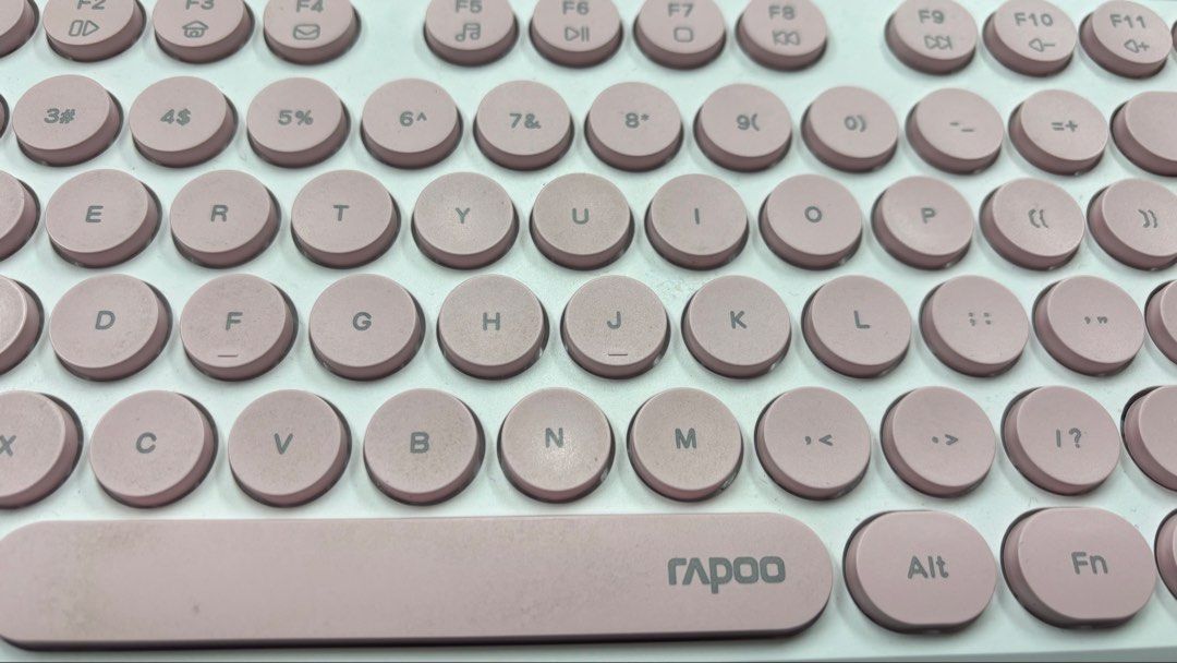 Rapoo Wireless Keyboard White and Pink (Category: Computer Keyboard) located in Quezon City. Submitted by aistar (Listing ID 1468066158, Image 2). Description: - All keys and functions working properly - Colorway: Aesthetic white body with soft pink keys - Design: Cute round typewriter-style keycaps with a full numeric keypad and standard function keys - Connectivity: Wireless for a clutter-free desk - Condition: Great desk setup upgrade, ready t