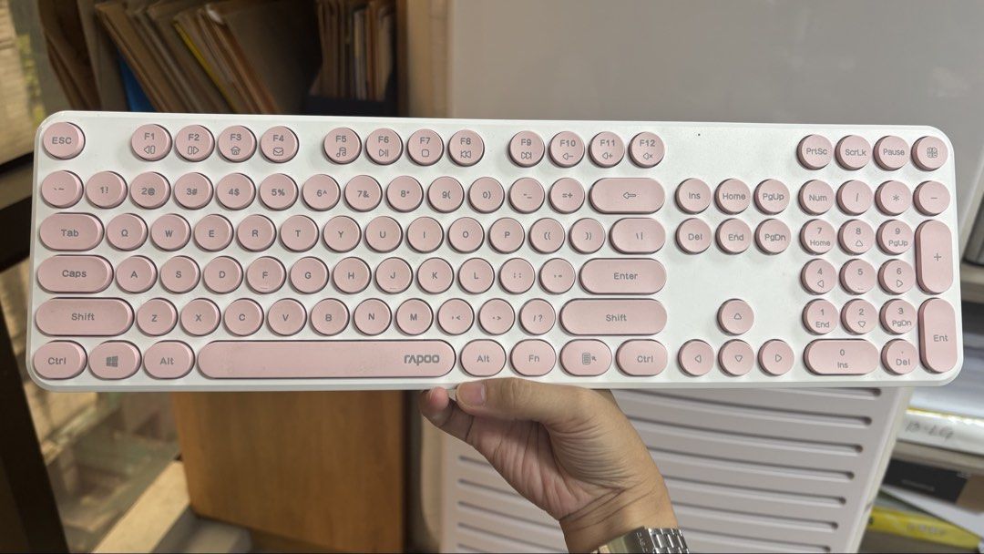 Rapoo Wireless Keyboard White and Pink (Category: Computer Keyboard) located in Quezon City. Submitted by aistar (Listing ID 1468066158, Image 1). Description: - All keys and functions working properly - Colorway: Aesthetic white body with soft pink keys - Design: Cute round typewriter-style keycaps with a full numeric keypad and standard function keys - Connectivity: Wireless for a clutter-free desk - Condition: Great desk setup upgrade, ready t