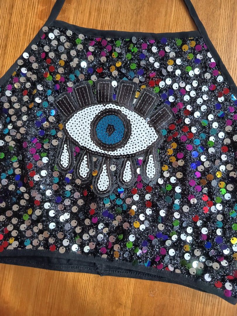 Rare Y2k evil eye sequins halter top (Category: Others Tops) located in Rizal. Submitted by joy_whisky (Listing ID 1468235765, Image 2). Description: Perfect for festivals, concerts, beach party, Halloween, or night out! Super eye-catching in person. Details: • Brand: PrettyLittleThing / PLT • Size: 10 on tag - fits Small to Medium (US 6) • Color: Black with multicolor sequins + evil eye design • Style: Halter neck with tie, cropped, open back • 