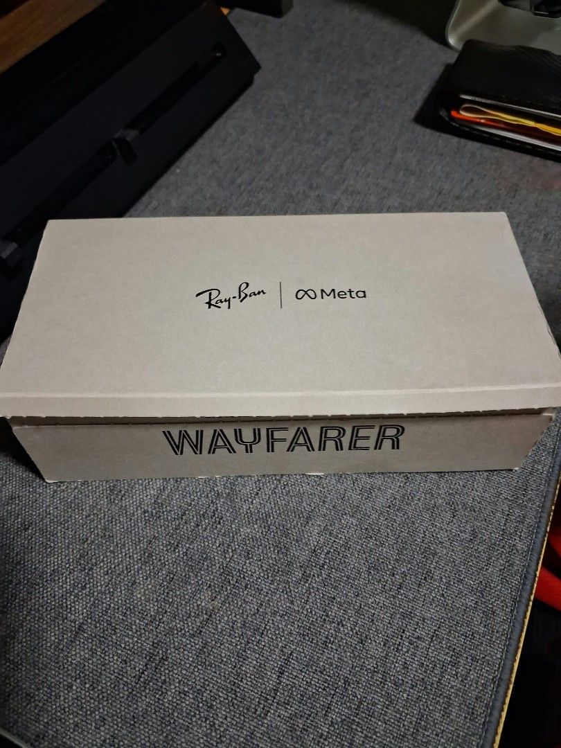 Ray-Ban Meta Wayfarer Smart Glasses (Category: Sunglasses & Eyewear) located in Taguig. Submitted by feb1303 (Listing ID 1468237992, Image 3). Description: Ray-Ban Meta Wayfarer smart glasses in matte black frames. 9month old. Built-in cameras and audio for calls, music, and streaming. Includes the original brown leather charging case and branded box packaging. Unworn condition, stored properly inside the box..