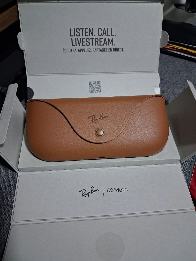 Ray-Ban Meta Wayfarer Smart Glasses (Category: Sunglasses & Eyewear) located in Taguig. Submitted by feb1303 (Listing ID 1468237992, Image 2). Description: Ray-Ban Meta Wayfarer smart glasses in matte black frames. 9month old. Built-in cameras and audio for calls, music, and streaming. Includes the original brown leather charging case and branded box packaging. Unworn condition, stored properly inside the box..