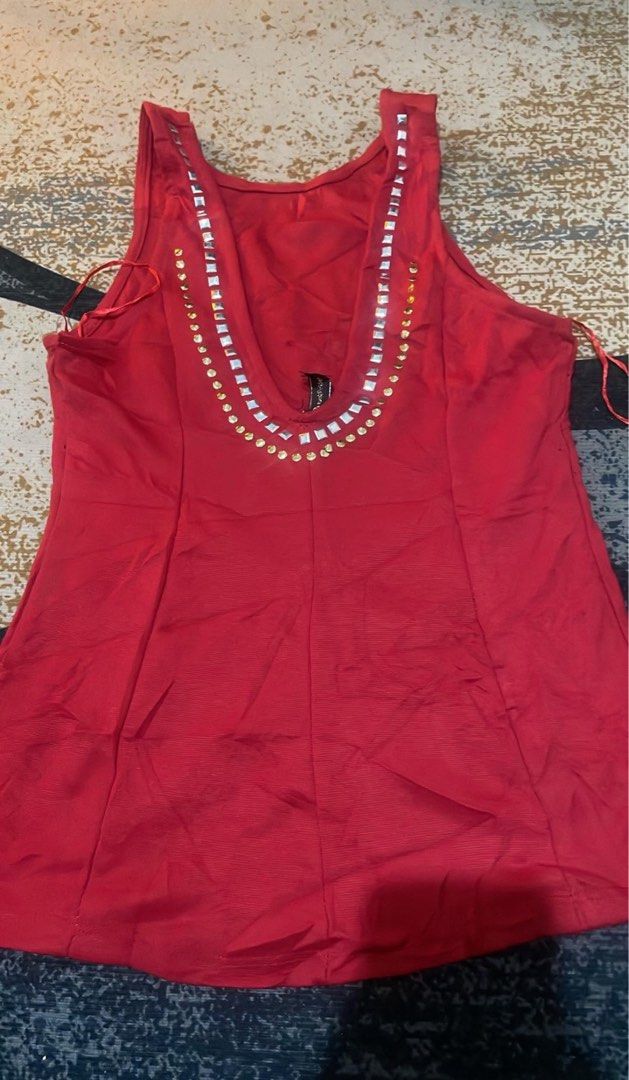 Red Rhinestone Embellished Tank Top (Category: Sleeveless) located in Lapu Lapu. Submitted by ruby_welly22 (Listing ID 1468263782, Image 2). Description: - Brand: Rouge Couture - Size: L - Color: Vibrant Red - Style: Sleeveless tank top with a deep scoop back - Details: Sparkling rhinestone and metal stud embellishments along the front and back neckline - Condition: Excellent, ready to wear.