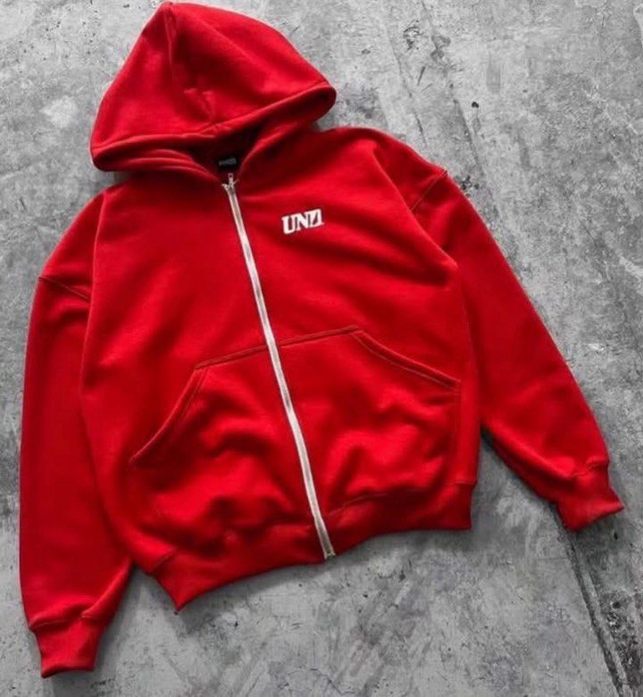 Red UNDZ Full-Zip Hoodie (Category: Hoodies) located in Manila. Submitted by psgarchives (Listing ID 1468191979, Image 1). Description: - Color: Bright red with white chest and back graphics - Material: Heavy, cozy fleece for ultimate warmth - Features: Full-length front zipper, spacious hood, and roomy front pockets - Details: Ribbed cuffs and hem to lock in heat - Condition: Clean fabric, highly comfortable for daily wear.