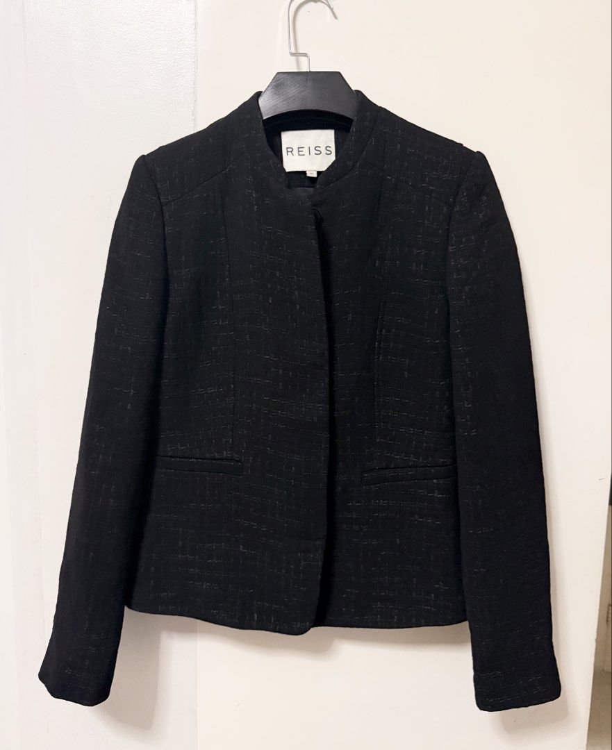 Reiss Black Blazer XS (Category: Coats, Jackets and Outerwear) located in San Pablo. Submitted by iamtrina (Listing ID 1468244901, Image 2). Description: Beautifully made tailored blazer features a subtly textured tweed/bouclé weave, clean hidden front closures, and horizontal welt pockets at the waist, making it a sophisticated choice for formal wear or business attire. .