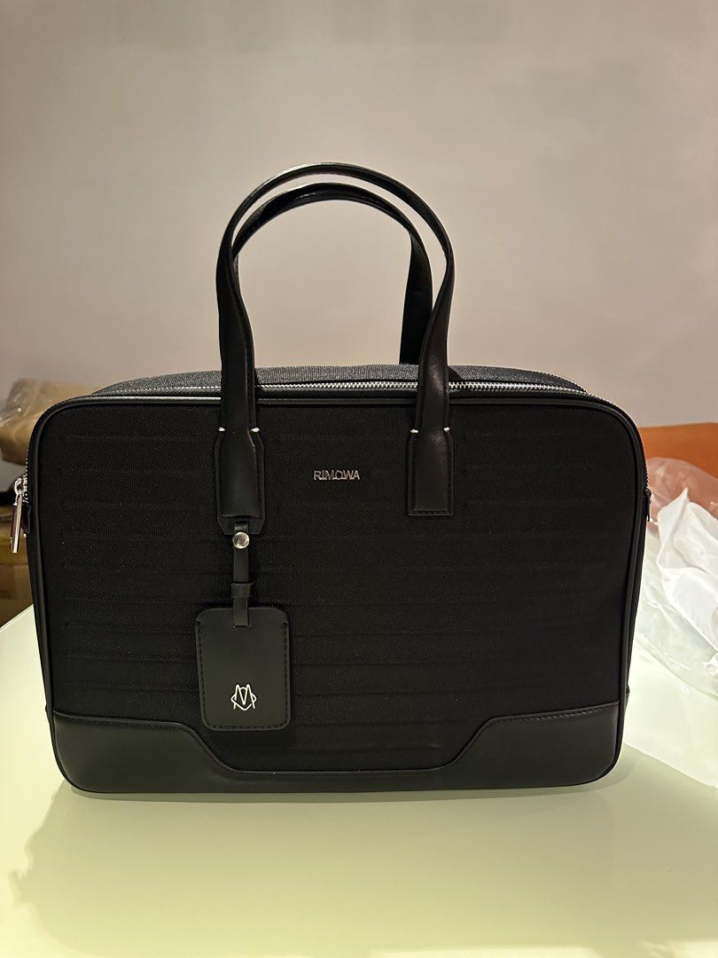 Rimowa Briefcase (Category: Luxury Bags & Wallets) located in Manila. Submitted by grischfinds (Listing ID 1468136374, Image 1). Description: Rimowa Never Still Canvas Briefcase 8,000php inclusions: -strap that has never been used - dustbag Thrifted this at Japan for 25500 JPY.. , the logo was repaired according to sales lady since it was falling off, the handle was also replaced due to aging and was stitched back together. I’m only selling this 