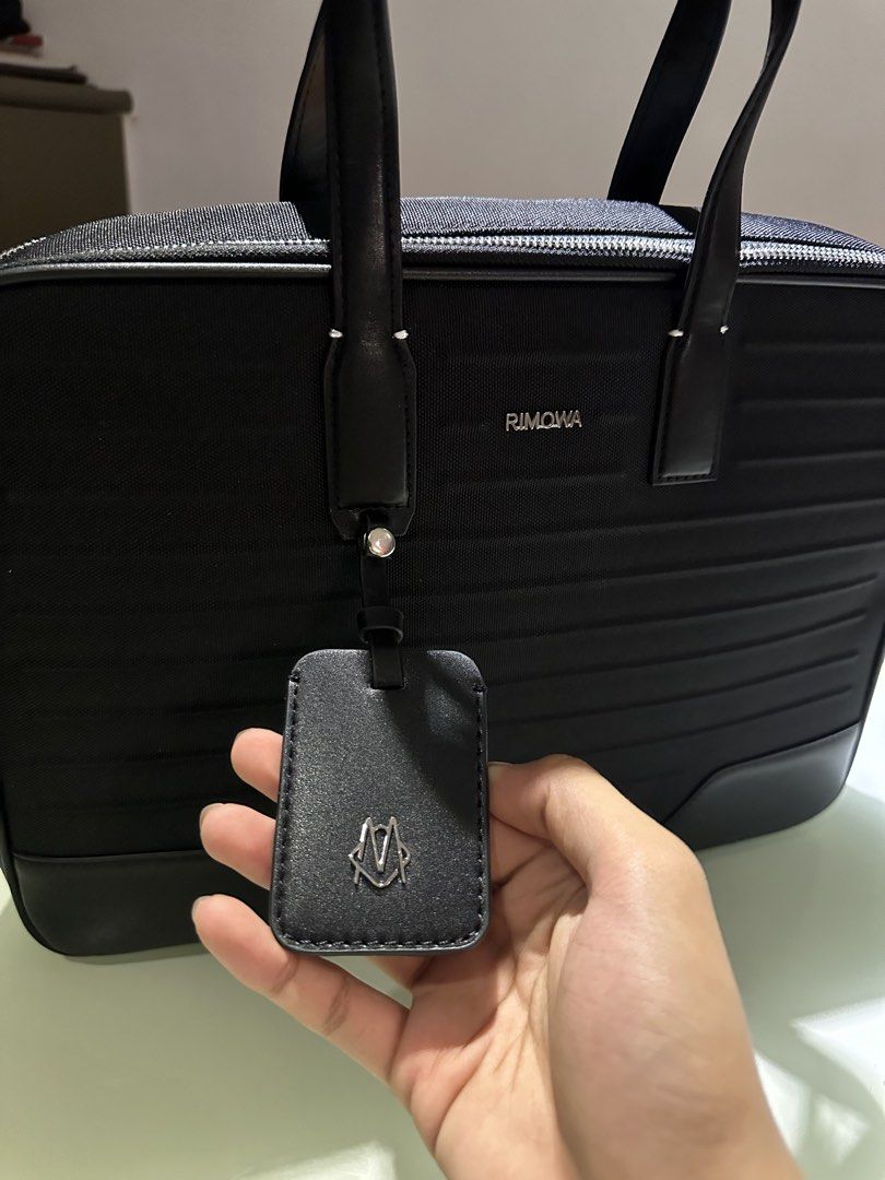 Rimowa Briefcase (Category: Luxury Bags & Wallets) located in Manila. Submitted by grischfinds (Listing ID 1468136374, Image 2). Description: Rimowa Never Still Canvas Briefcase 8,000php inclusions: -strap that has never been used - dustbag Thrifted this at Japan for 25500 JPY.. , the logo was repaired according to sales lady since it was falling off, the handle was also replaced due to aging and was stitched back together. I’m only selling this 