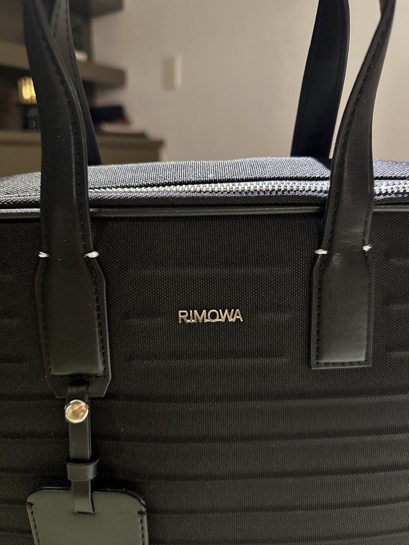 Rimowa Briefcase (Category: Luxury Bags & Wallets) located in Manila. Submitted by grischfinds (Listing ID 1468136374, Image 3). Description: Rimowa Never Still Canvas Briefcase 8,000php inclusions: -strap that has never been used - dustbag Thrifted this at Japan for 25500 JPY.. , the logo was repaired according to sales lady since it was falling off, the handle was also replaced due to aging and was stitched back together. I’m only selling this 