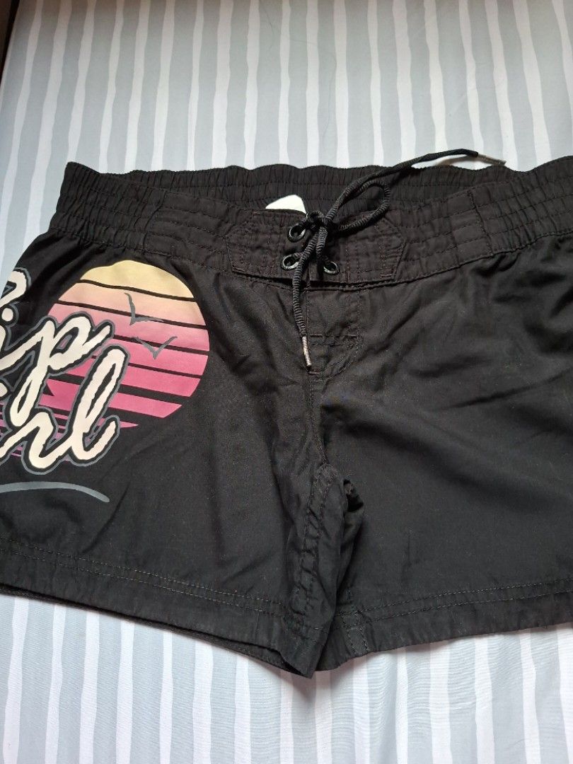 Rip curl board shorts (Category: Bikinis & Swimsuits) located in Binangonan. Submitted by anjiscloset (Listing ID 1468071055, Image 1). Description: - Brand: Rip Curl - Color: Classic Black - Material: 100% lightweight polyester (easy to wash) - Waistband: Elastic with trendy ruffled detailing - Origin: Made in China tag intact - Condition: Excellent, ready to wear.