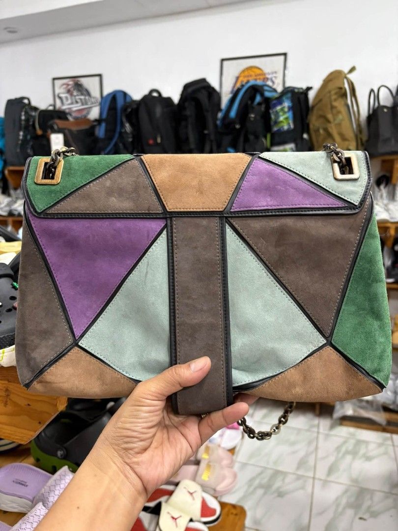 Roger Vivier Multicolored Suede Patchwork Chain Shoulder Bag (Category: Luxury Bags & Wallets) located in Abucay. Submitted by chinithou (Listing ID 1468281884, Image 2). Description: - Brand: Roger Vivier Paris - Material: Multicolored suede in geometric panels (purple, green, grey, brown) - Hardware: Gold-tone chain strap and front buckle closure with logo engraving - Interior: Black fabric lining with multiple compartments and zippered pockets