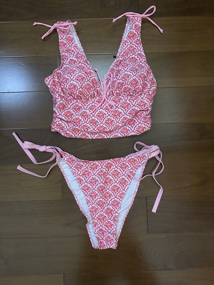 ROMWE Pink Floral Pattern Tankini Bikini Set (Category: Bikinis & Swimsuits) located in Marikina City. Submitted by blk1012_ (Listing ID 1468223881, Image 1). Description: - Brand: ROMWE - Item: Pink and red floral damask bikini set (Two-piece swimsuit) - Size: 0XL - Condition: Brand new with original tags, never worn - Features: Tankini top with adjustable tie straps and matching side-tie bottoms.