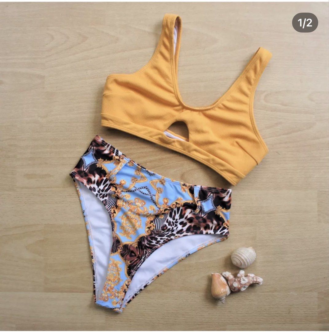 ROMWE Yellow and Blue Leopard Print Bikini Set Size M (Category: Bikinis & Swimsuits) located in Bulacan. Submitted by peach1025 (Listing ID 1468111175, Image 1). Description: - Brand/Style: ROMWE two-piece swimsuit - Size: Medium (tag attached) - Top: Ribbed mustard yellow crop top with front cutout - Bottoms: High-waisted with blue, gold baroque, and leopard print - Lining: Fully lined white interior - Condition: Brand new with tags, great for 