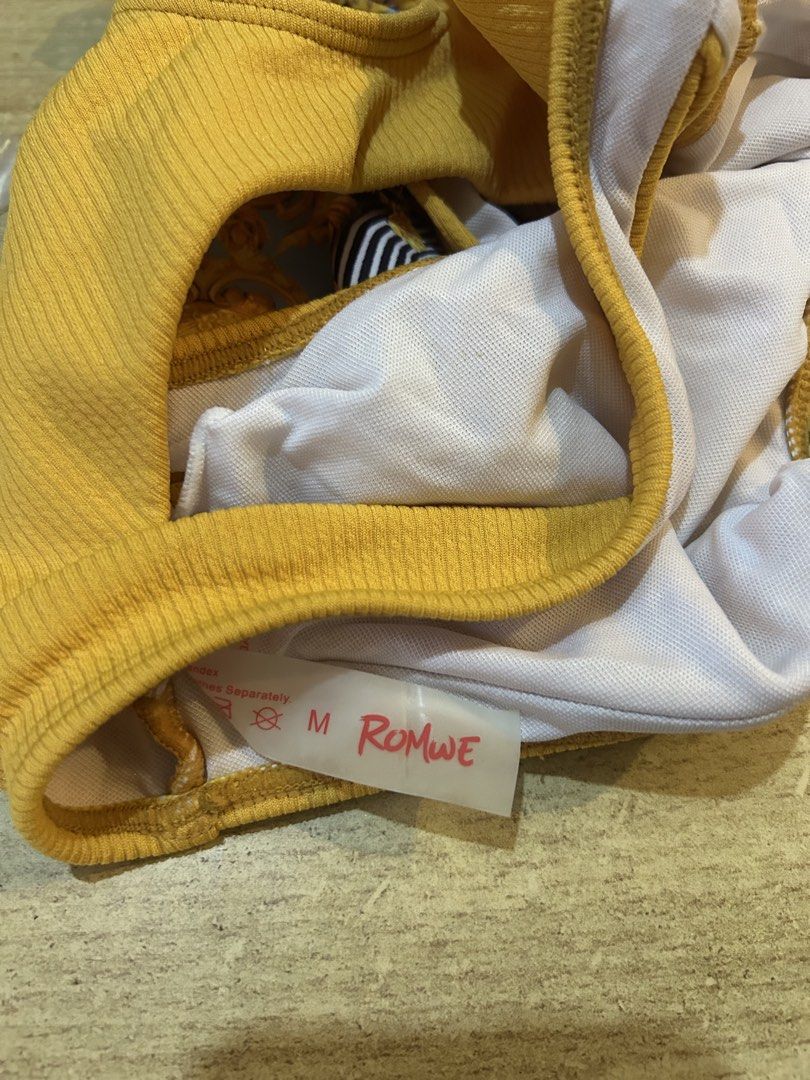 ROMWE Yellow and Blue Leopard Print Bikini Set Size M (Category: Bikinis & Swimsuits) located in Bulacan. Submitted by peach1025 (Listing ID 1468111175, Image 3). Description: - Brand/Style: ROMWE two-piece swimsuit - Size: Medium (tag attached) - Top: Ribbed mustard yellow crop top with front cutout - Bottoms: High-waisted with blue, gold baroque, and leopard print - Lining: Fully lined white interior - Condition: Brand new with tags, great for 