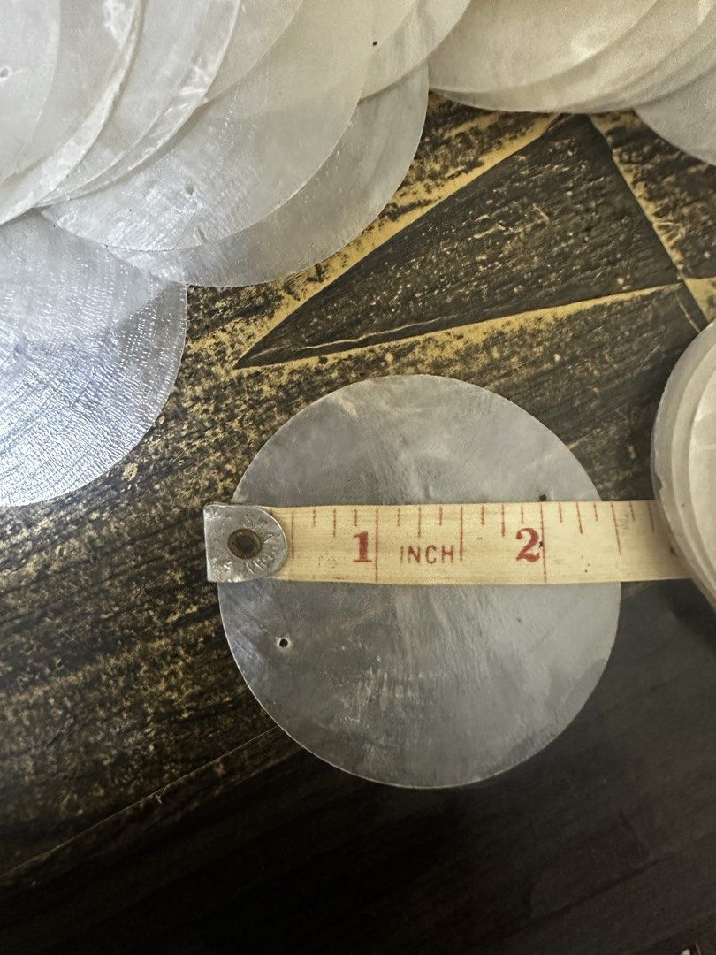 Round Capiz Shell (Category: Craft Supplies & Tools) located in Manila. Submitted by macky2026 (Listing ID 1468217769, Image 3). Description: Capiz Shell discs (2.5 inches / approx. 65mm). Used as a shop accent feature. Dismantled, cleaned, and stored. ✨ KEY FEATURES: • Size: 2.5 inches (Round Cut), polished, cleaned no fishy odor • Design: Pre-drilled with TWO (2) HOLES. 💰 PRICE & PACKS: • Pack of 25 pcs: ₱200.00 .