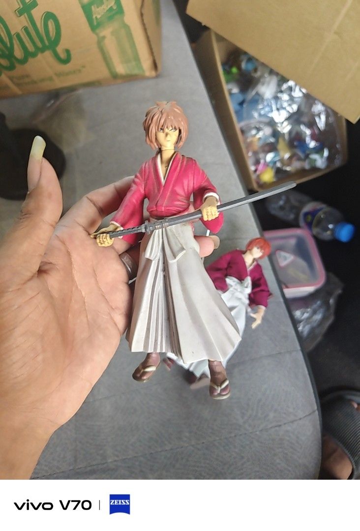 Rurouni Kenshin Action Figure Set (Category: Figurines & Statues) located in Kapangan. Submitted by ClumZyDale (Listing ID 1468135155, Image 2). Description: - Set of 2 authentic Rurouni Kenshin action figures - Detailed red kimono and white hakama outfits - Includes miniature sword accessories - Fully articulated joints for dynamic posing - Comes with official display bases featuring copyright markings.